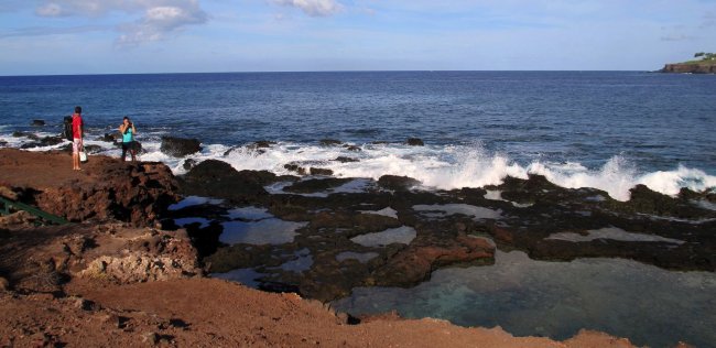 Visitors look over Keiki (Kids) Pond that was created by locals in the 1950s using dynamite off Hulopo’e Bay on Lanai in Hawaii. (Seattle Times/MCT)