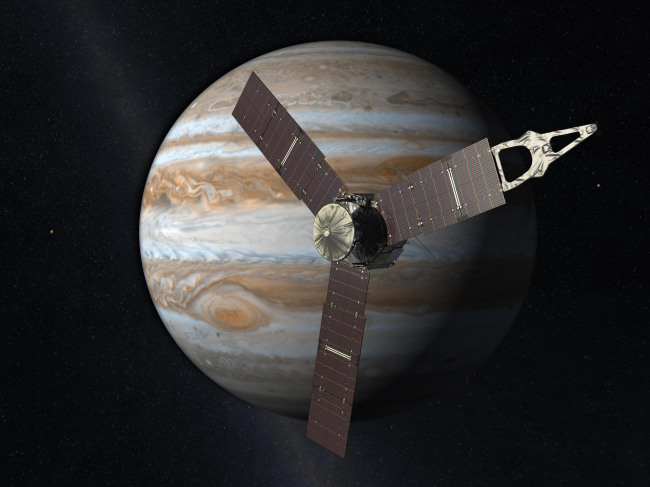 This 2010 artist‘s rendering depicts NASA’s Juno spacecraft with Jupiter in the background.   AP-Yonhap News