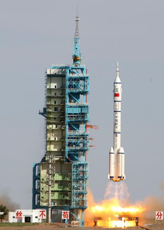 Image shows the Shenzhou-10 rocket blasting off from the Jiuquan space centre in China.   AFP