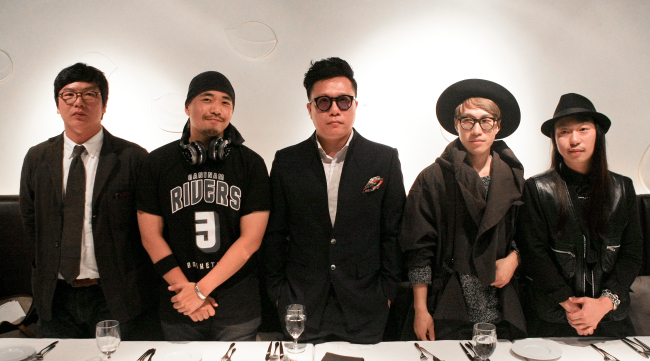 Participating designers and artists of Fashion Kode pose at a press briefing held on Monday in Seoul. From left: Bastong CEO Ki Nam-hae; illustrator Kwang; artist and designer KUN; and fashion designers Kim Hong-beom and Shin Yong-kyun.   Korea Creative Content Agency
