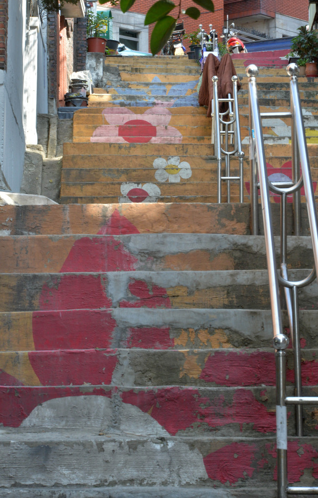 Stairways are painted in the design street of Sogeumgil, Yeomni-dong, Seoul.   Lee Sang-sub/The Korea Herald