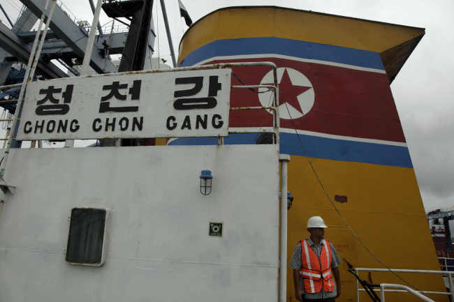 In this July 16, 2013 file photo, Panamanian presidential security detail walks on the deck aboard a North Korean-flagged ship at the Manzanillo International container terminal on the coast of Colon City, Panama. (AP-Yonhap News)