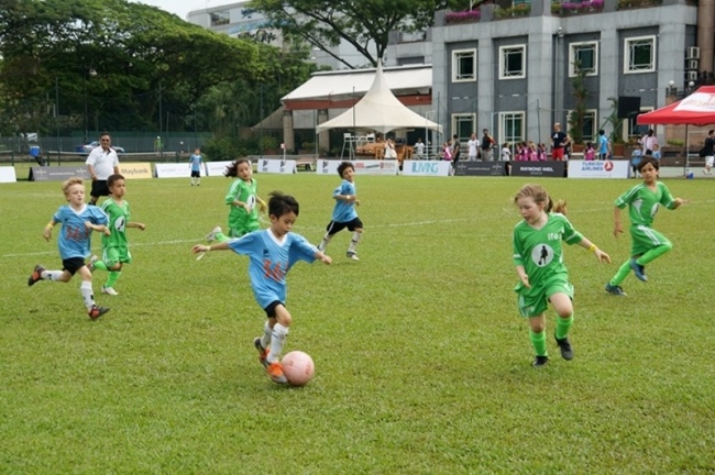 Kids at International Football Education play in a warm-up match for the Asia Soccer Shootout, which starts Saturday.   IFE