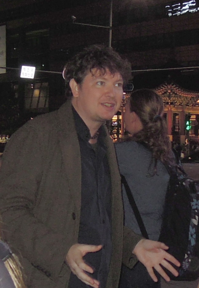 Joe McPherson leads a recent Dark Side of Seoul Tour.   Paul Kerry/The Korea Herald