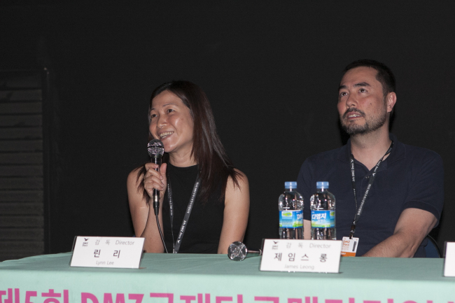 Singaporean filmmakers Lynn Lee (left) and James Leong speak about their documentary “The Great North Korean Picture Show” after the movie’s Korean premiere during DMZ Docs in Goyang, Gyeonggi Province, Monday.   DMZ Docs