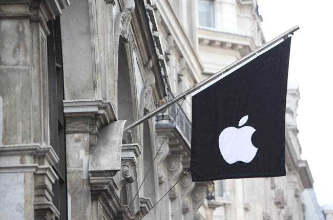 The Apple Inc. logo is displayed on a flag outside the company’s store on Regents Street in London.   Bloomberg