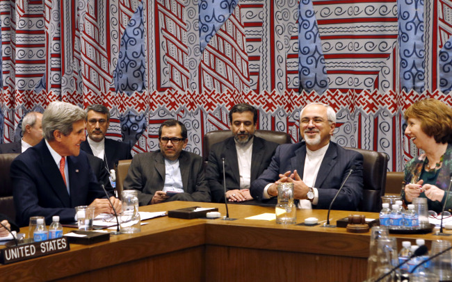 In this Sept. 26 file photo, seated at the table from left, U.S. Secretary of State John Kerry, Iranian Foreign Minister Mohammad Javad Zarif and European Union foreign policy chief Catherine Ashton attend a meeting of the five permanent members of the Security Council plus Germany during the 68th session of the United Nations General Assembly at U.N. headquarters.   AP-Yonhap News