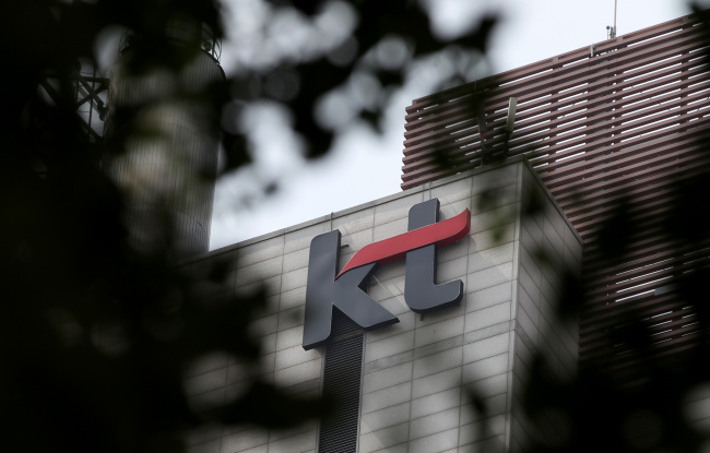 The KT Corp. logo is displayed atop one of the company’s branches in Seoul.   Bloomberg