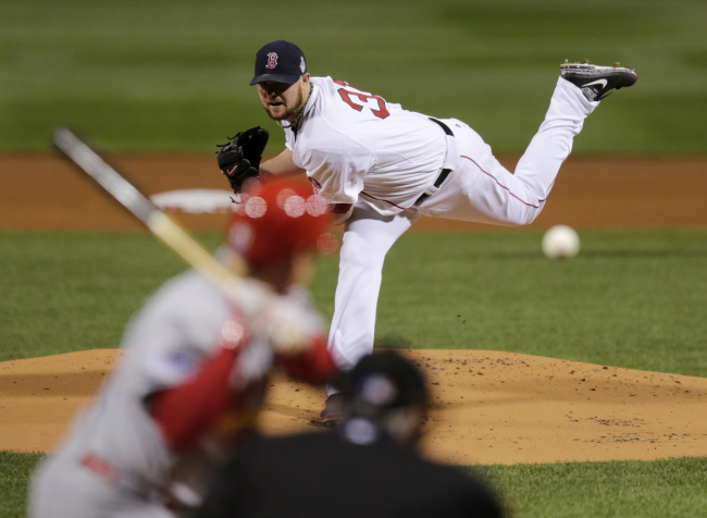 Boston Red Sox starting pitcher Jon Lester throws during the first inning of Game 1 of baseball's World Series against the St. Louis Cardinals Wednesday. (AP-Yonhap News)