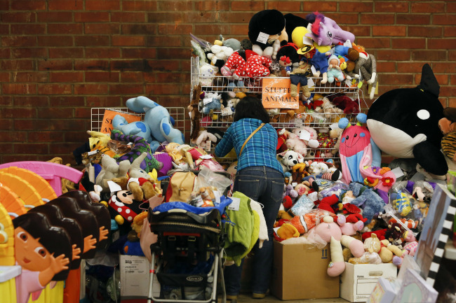A customer browses through previously owned stuffed animals for sale during the L.A. Kids Consignment Sale in Burbank, California, Wednesday.   Bloomberg