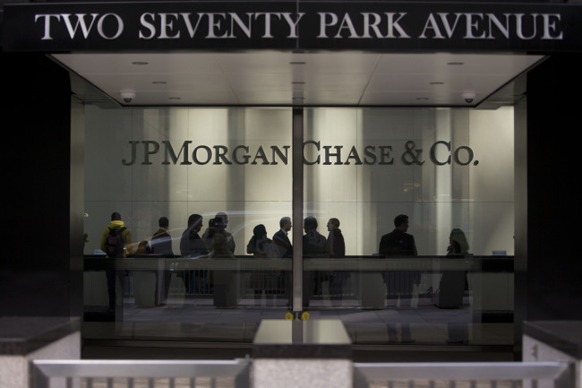 People stand in the lobby of the JPMorgan Chase & Co. headquarters in New York.    Bloomberg