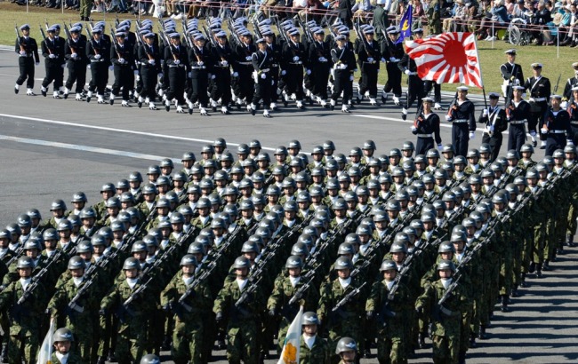 Members of Japan Self-Defence Forces attend the military review at the
Ground Self-Defence Force’s Asaka training ground on Sunday. (Xinhua-Yonhap News)