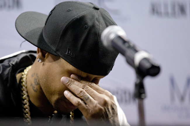 Former Philadelphia 76ers basketball player Allen Iverson wipes his eyes during a news conference on Wednesday in Philadelphia. (AP)