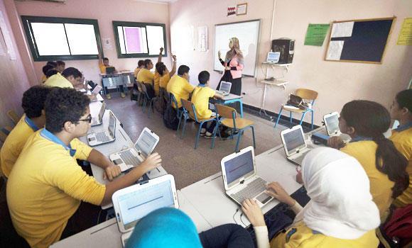 Egyptian students attend a secondary school class at a private school in Cairo.   AFP