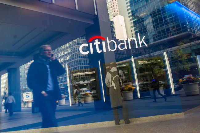A customer uses an automated teller machine inside of a Citibank branch on Park Avenue in New York.   Bloomberg