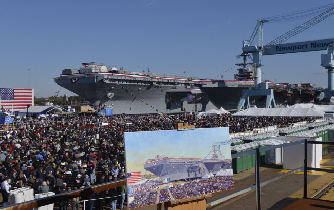 Guests attend the christening ceremony of USS Gerald R. Ford at the Huntington-Ingalls Industries Newport News shipyard in Virginia on Saturday.   Xinhua-Yonhap News