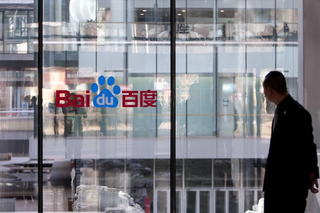 The Baidu Inc. logo is displayed on a window at the company’s headquarters in Beijing.    Bloomberg