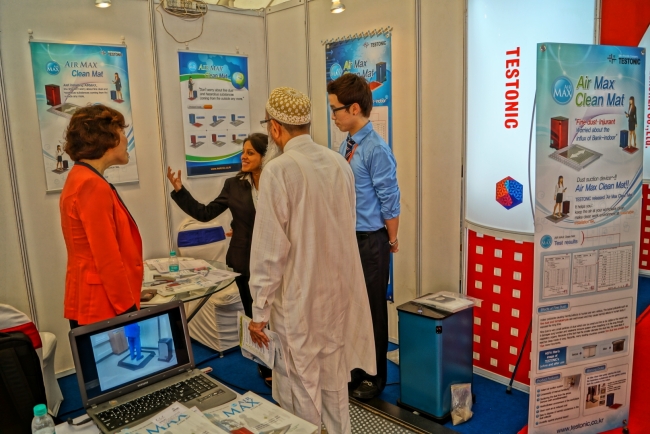 A Testonic employee explains Air Max to buyers visiting its promotional booth at a trade show.   Testonic