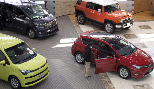 Toyota Motor Corp. vehicles are displayed in the showroom at the company’s headquarters in Toyota City, Aichi prefecture, Japan.   Bloomberg