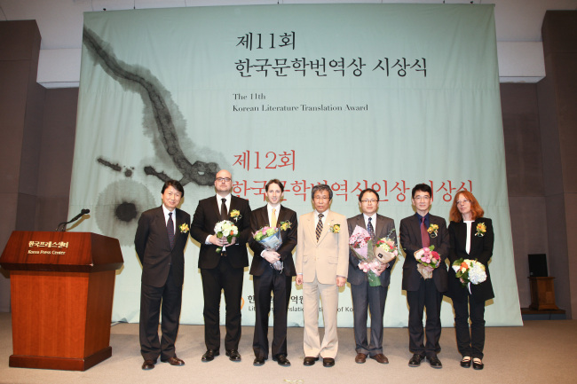 The winners of the 12th Korean Literature Translation Award pose for a photo at the awards ceremony in central Seoul, Monday. From right: Miriam Lowensteinova, Song Byeong-sun, Kim Hak-cheol, LTI Korea director Kim Seong-kon, Charles La Shure, Marek Zemanek, and Kwon Young-min, the head judge for the award.   LTI Korea