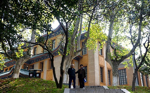 A visitor outside restored 80-year-old house once used by Chiang Kai-shek in Zhejiang Province.   AFP