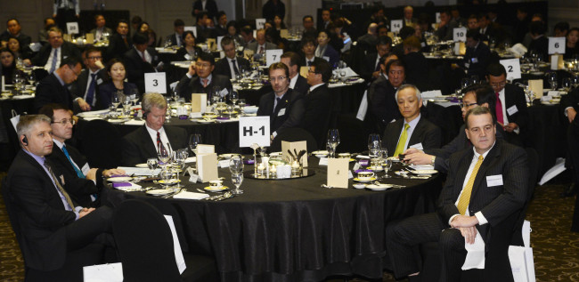 Participants listen to an address at the CEO Forum for Foreign-Invested Companies 2013 at a Seoul hotel on Thursday.    Park Hae-mook/The Korea Herald