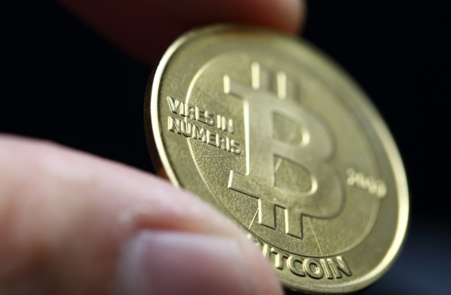 A bitcoin is arranged for a photograph in Tokyo.   Bloomberg