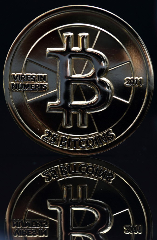 A bitcoin is arranged for a photograph in Tokyo.   Bloomberg