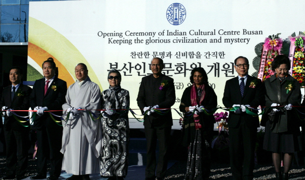This photo provided by Tongmyong University shows Indian Ambassador to Korea Vishnu Prakash (fourth from right), Tongmyong University president Seol Dong-geun (second from right) and others cutting the ribbon to open the Indian Cultural Center Busan on Friday.    Yonhap News