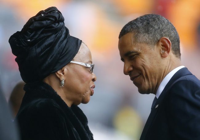 U.S. President Barack Obama pays his respect to Mandela's widow Graca Machel after his speech at the memorial service for late South African President Nelson Mandela at the FNB soccer stadium in Johannesburg on Dec. 10. Reuters-Yonhap News