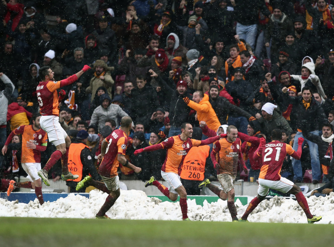 Galatasaray players celebrate after their Champions League match victory over Juventus on Wednesday.   AP-Yonhap News