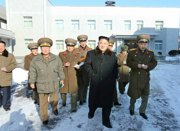 North Korean leader Kim Jong-un (front row, second from right) walks with his aides.                                     (Yonhap News)