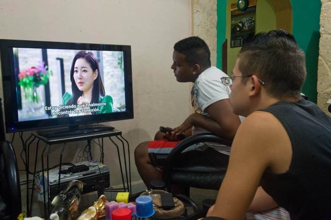 Cubans watch a DVD of a South Korean soap opera in Havana.   AFP-Yonhap News