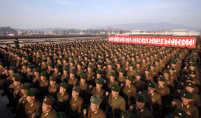 This photo released by the (North) Korean Central News Agency shows thousands of soldiers gathering in the square of the Kumsusan Palace of the Sun in Pyongyang, Monday, on the eve of the second anniversary of the death of former ruler Kim Jong-il.   Yonhap News