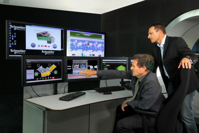 Specialists of Schneider Electric monitor the energy management system installed in the company’s headquarters in Rueil Malmaison, near Paris.   Schneider Electric