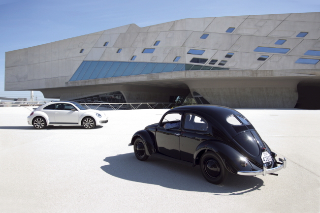 The latest, third-generation Volkswagen Beetle (left) and the early vintage model.   Volkswagen Korea