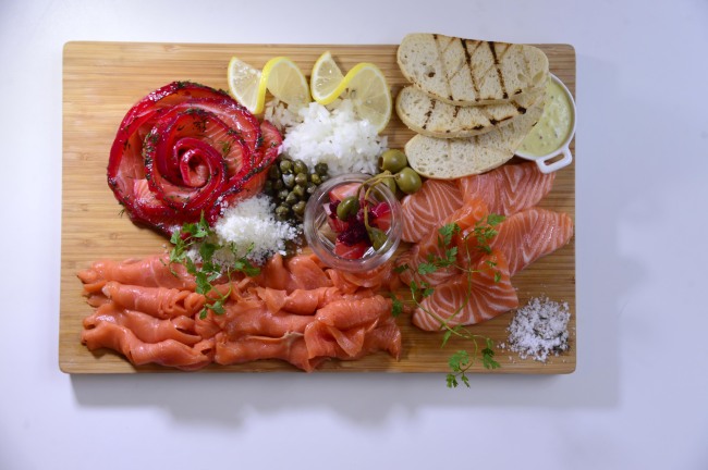 The Healing Salmon Platter features house-cured gravlax, cold-smoked salmon, sashimi and a salmon belly gravlax with beets and caperberries.   Park Hae-mook/The Korea Herald