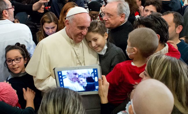 Pope Francis poses with children while visiting the Bambino Gesu Children’s Hospital in Rome on Saturday.   AFP-Yonhap News
