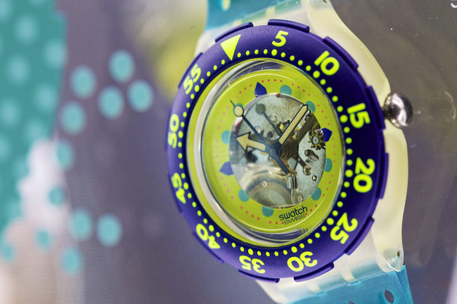 A Swatch SDK101 wristwatch sits on display in Grenchen, Switzerland.  Bloomberg