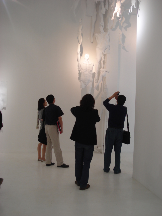 Viewers look at art on display at Pyo Gallery 798 in Beijing. Pyo Gallery 798