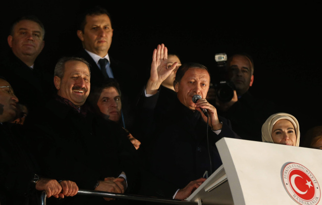 Turkey’s Prime Minister Tayyip Erdogan addresses supporters upon his arrival at Esenboga Airport in Ankara on Tuesday.   AFP-Yonhap News
