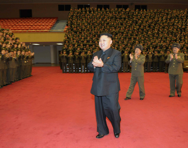This undated photo released by the Rodong Shinmun shows North Korean leader Kim Jong-un applauding during soldiers’ recent martial arts training.  Yonhap News
