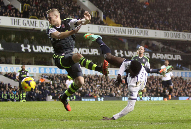 Stoke City’s Ryan Shawcross (left) blocks a volley from Tottenham Hotspur’s Emmanuel Adebayor with his hands to give away a penalty at White Hart Lane, London, Sunday.    AP-Yonhap News