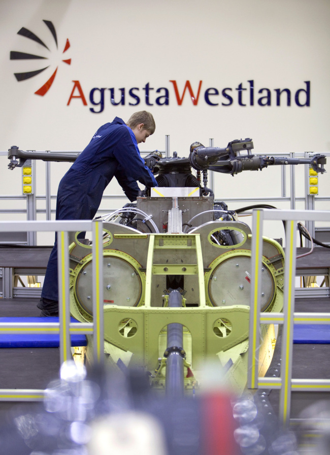 A mechanic works on the gearbox of an AW159 Lynx Wildcat helicopter at the Finmeccanica AgustaWestland factory in Yeovil, U.K.   Bloomberg