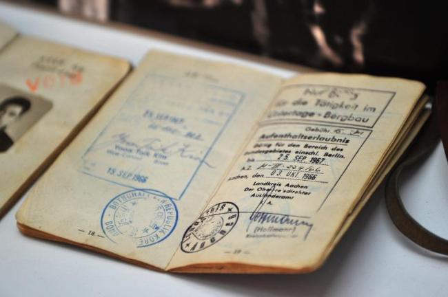 A Korean miner’s passport with departure stamp and German visa is displayed at the Memorial House of Miners and Nurses Dispatched to Germany in Seoul, on Dec. 31.   AFP