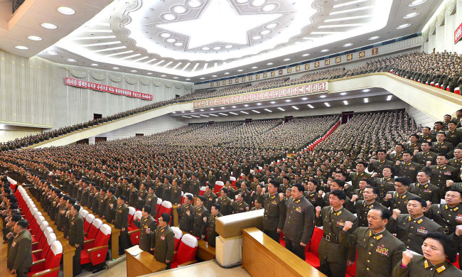 North Korean military officials hold a rally at an assembly hall in Pyongyang on Thursday.   Yonhap News