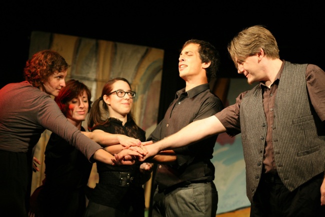 Kaci Beeler (center) with performers of the Hideout Theater, an improv venue she runs in Austin, Texas. John Bolden