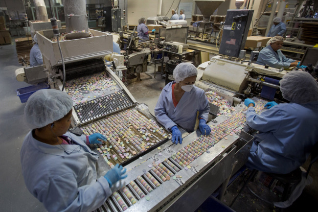 Workers sort “Necco Wafers” at the New England Confectionery Co. in Revere, Massachusetts.   Bloomberg