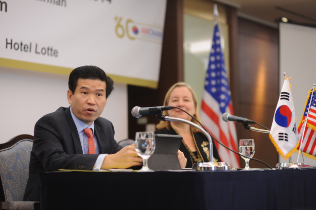 James Kim (left), chairman of the American Chamber of Commerce in Korea and Country Manager of Microsoft Korea, speaks alongside Amy Jackson, president of AMCHAM Korea, in a news conference in Seoul on Wednesday.   AMCHAM