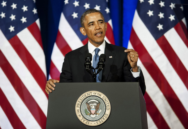 U.S. President Barack Obama speaks at the Department of Justice in Washington, D.C., Friday.   Bloomberg